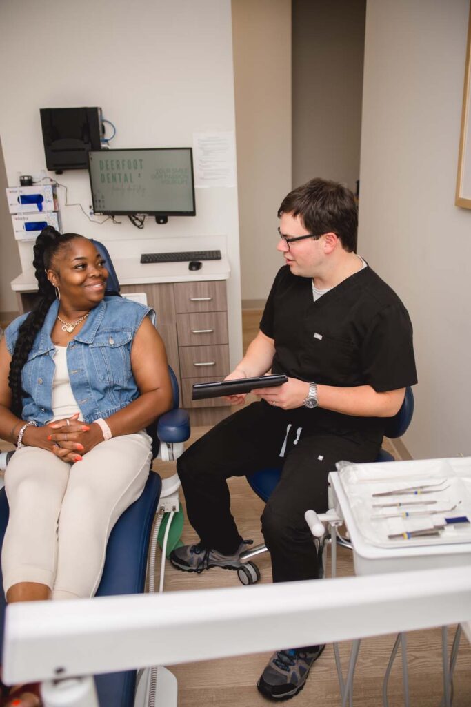 man dentist showing procedure